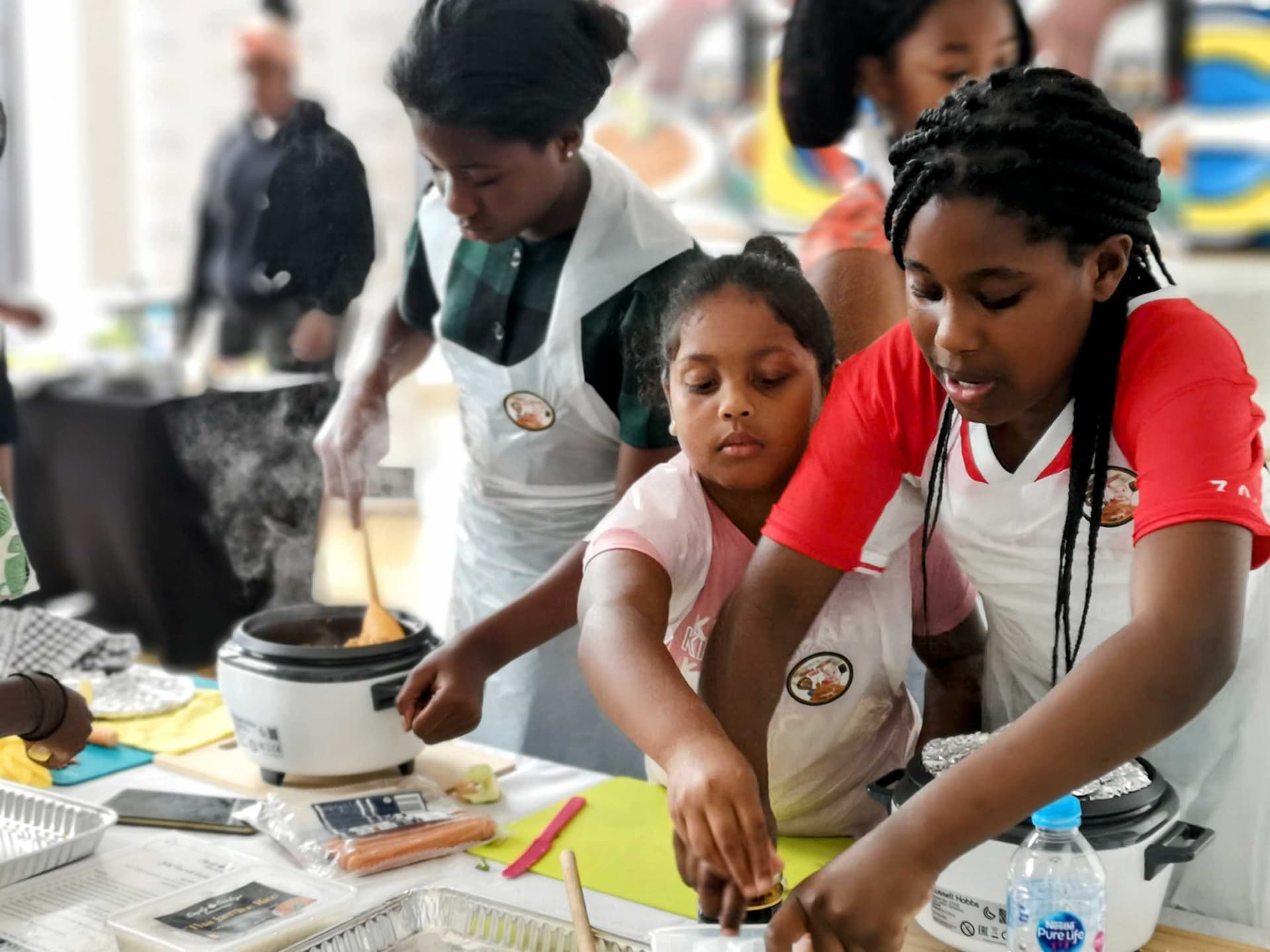 Students learning cooking skills
